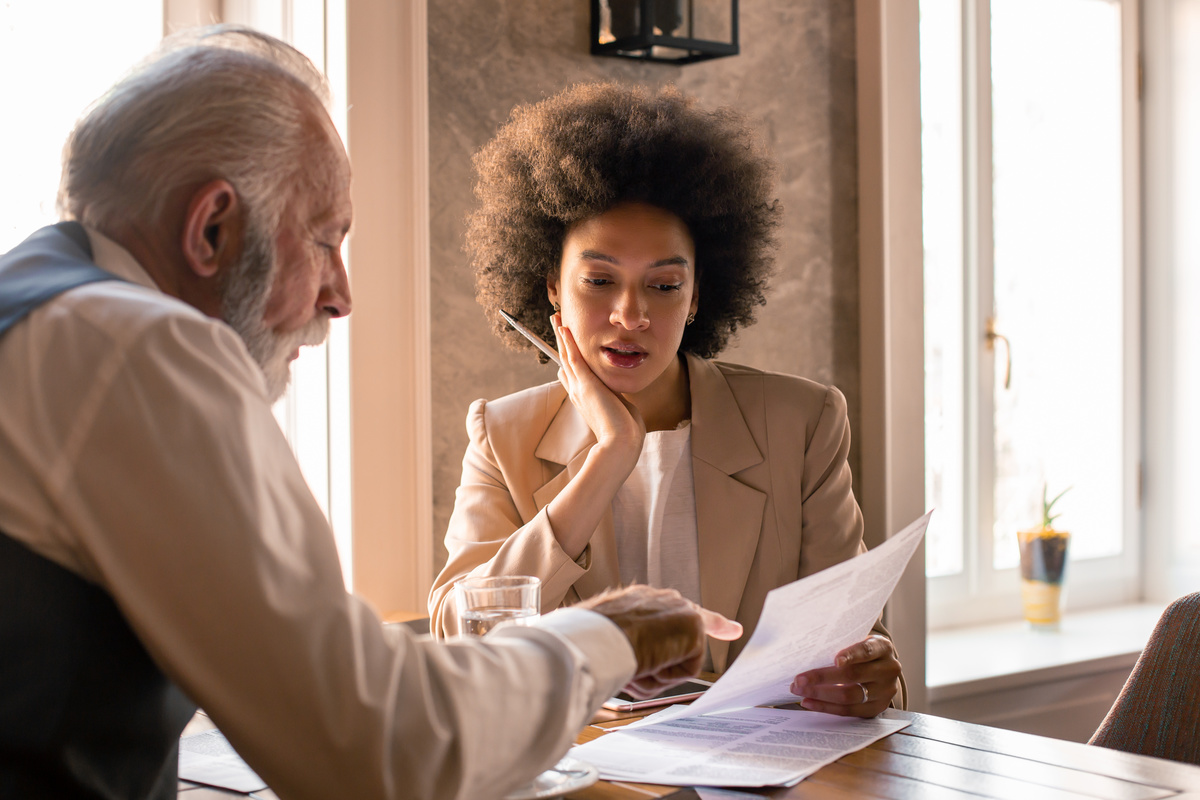 An insurance professional reviewing the details of the contract.